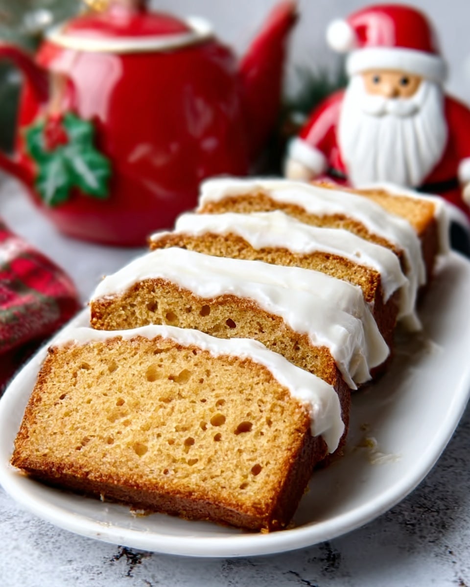 The image shows a white plate holding five slices of a golden brown cake, each topped with a thick layer of white icing, sliding slightly over the sides. The cake has a moist texture with tiny air holes visible throughout. The white icing contrasts sharply against the warm brown color of the cake. The background includes a blurred red and white teapot and a festive decoration with a Santa figure wearing a red hat, sitting on a white marbled surface. Photo taken with an iphone --ar 4:5 --v 7