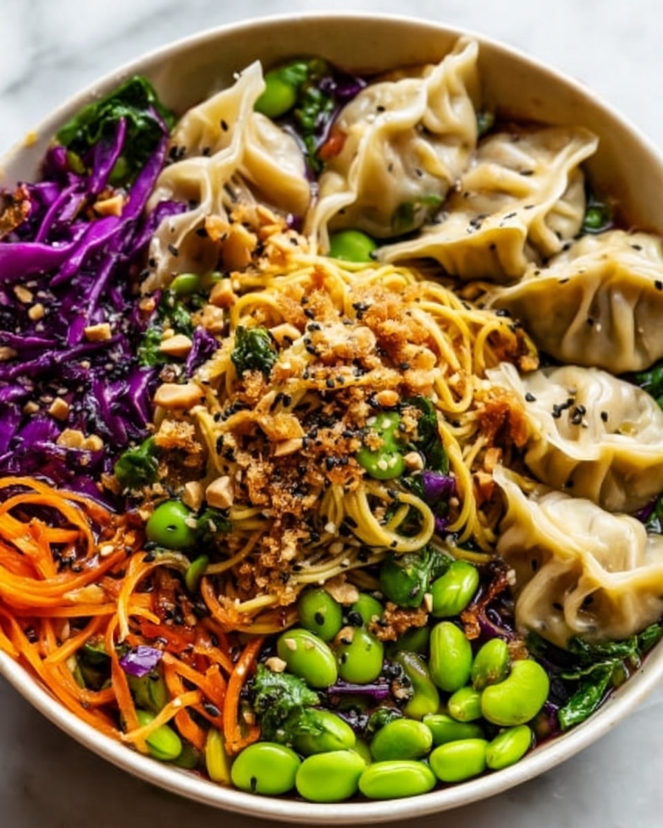 This image shows a bowl full of colorful food on a white marbled surface. The bowl is white and inside it there are multiple layers: the bottom layer has purple cabbage, bright green edamame beans, and some leafy green vegetables. On top of this, there are golden brown noodles mixed with green spinach and small orange carrot strips. Around the noodles, there are several light beige dumplings with black sesame seeds sprinkled on them. Crushed peanuts and sesame seeds are scattered over the noodles adding texture. The image has a fresh, vibrant look with many colors and textures all together, creating a lively and tasty appearance. Photo taken with an iphone --ar 4:5 --v 7